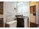 A full, but dated bathroom with a toilet, vanity, mirror, and linoleum tile at 2486 Daytona Park Rd, Deland, FL 32724