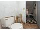 Bathroom with toilet, showing potential for renovation and access to a bedroom at 2486 Daytona Park Rd, Deland, FL 32724