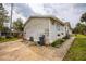 Driveway view of home showing siding, yard with grass, and outdoor features at 2486 Daytona Park Rd, Deland, FL 32724