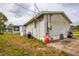 Exterior view of home showing siding, yard with grass, and AC unit at 2486 Daytona Park Rd, Deland, FL 32724