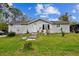 Charming single-story home featuring a well-maintained lawn and cozy front porch at 2486 Daytona Park Rd, Deland, FL 32724