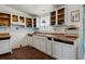 Kitchen featuring rustic open cabinets, durable counter tops, and an ornate hanging lamp at 2486 Daytona Park Rd, Deland, FL 32724