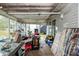 Enclosed screen room showing windows, ceiling and the room is full of various objects at 2486 Daytona Park Rd, Deland, FL 32724
