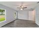 A bedroom with light gray walls and wide plank wood-look flooring at 15673 Sw 37 Cir, Ocala, FL 34482