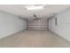 A spacious two car garage with a gray garage door at 15673 Sw 37 Cir, Ocala, FL 34482