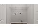 Laundry room with new flooring, wire rack, and washer hookups at 15673 Sw 37 Cir, Ocala, FL 34482