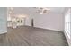 Open floor plan of the living room with vaulted ceilings and modern wide plank flooring at 15673 Sw 37 Cir, Ocala, FL 34482