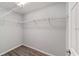 Walk-in closet featuring modern flooring, shelving, and ample space at 15673 Sw 37 Cir, Ocala, FL 34482
