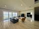 Bright, open living room with stylish furniture, large sliding glass doors, marble floors and a great view at 16832 Bolsena Dr, Bella Collina, FL 34756