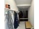 Functional mudroom with coat hooks, storage bench, and built-in cabinets for organizing outerwear and accessories at 16832 Bolsena Dr, Bella Collina, FL 34756