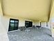 Covered patio featuring stylish outdoor furniture, perfect for entertaining and enjoying outdoor living at 16832 Bolsena Dr, Bella Collina, FL 34756