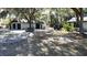 A spacious detached garage next to the house with beautiful trees enhancing this property's curb appeal at 11990 Se 112Th Avenue Rd, Belleview, FL 34420
