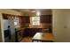 Traditional kitchen features stainless steel appliances, tile backsplash, and a cozy breakfast nook at 11990 Se 112Th Avenue Rd, Belleview, FL 34420