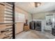 Basement laundry area featuring laundry machines, window and ample storage at 1630 Lakeview Ct, Eustis, FL 32726