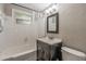 Cozy bathroom featuring a shower-tub combo with white tile and a modern vanity at 1630 Lakeview Ct, Eustis, FL 32726