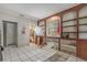 Spacious bonus room features storage shelves and tile flooring at 1630 Lakeview Ct, Eustis, FL 32726