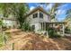 Exterior view of a home with a partially enclosed patio and landscaped yard at 1630 Lakeview Ct, Eustis, FL 32726
