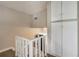 Upstairs hallway with white cabinets and railing shows landing area at 1630 Lakeview Ct, Eustis, FL 32726