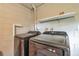 Laundry room featuring newer model washer and dryer with shelf at 1630 Lakeview Ct, Eustis, FL 32726