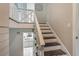 Staircase and landing offer an entry view to kitchen at 1630 Lakeview Ct, Eustis, FL 32726