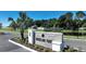Brookland Park community sign with manicured landscaping and a serene pond in the background at 2034 Babbling Brook Blvd, Auburndale, FL 33823