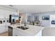 Modern kitchen featuring white cabinetry, stainless steel appliances, and an island at 2034 Babbling Brook Blvd, Auburndale, FL 33823
