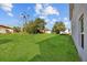 Spacious backyard featuring a well-maintained lawn and ample space for outdoor activities at 1132 Avenue K # A, Haines City, FL 33844