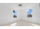 Empty bedroom with light wood floors, fresh paint, and natural lighting at 1132 Avenue K # A, Haines City, FL 33844
