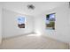 Minimalist bedroom featuring light wood floors, fresh paint, and natural light at 1132 Avenue K # A, Haines City, FL 33844