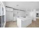 Modern kitchen featuring white cabinets, a kitchen island, and contemporary finishes at 1132 Avenue K # A, Haines City, FL 33844