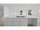 Close up on the kitchen island showing stainless steel sink and white cabinets at 1132 Avenue K # A, Haines City, FL 33844