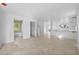 Open floorplan with light tile floors, and bar overlooking the kitchen at 1132 Avenue K # A, Haines City, FL 33844