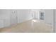 Open living room featuring tiled floors, multiple doors, and plenty of natural light at 1132 Avenue K # A, Haines City, FL 33844