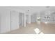 Open living room with tile floors, recessed lighting, and multiple doorways at 1132 Avenue K # A, Haines City, FL 33844