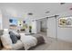 Relaxing main bedroom with ample natural light, barn door to en-suite bath and neutral décor at 1132 Avenue K # A, Haines City, FL 33844