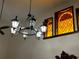 Elegant chandelier with stained glass windows at 1818 Lago Ct, St Cloud, FL 34769