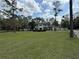 Charming two-story home with a well-manicured lawn and lush landscaping at 1818 Lago Ct, St Cloud, FL 34769