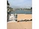 Dock and waterfront with a bench offering a serene view of the canal and surrounding neighborhood at 335 N Causeway # E3, New Smyrna Beach, FL 32169