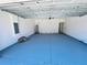 Clean garage with painted floor, showcasing a functional area for parking and storage at 1314 Congo Ct, Poinciana, FL 34759