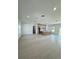 Spacious, open-concept living room with tile floors, recessed lighting, and views into other rooms at 1314 Congo Ct, Poinciana, FL 34759