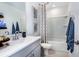 Bathroom featuring a single vanity, gray cabinets, and a bathtub with shower at 2549 Penguin Blvd, Davenport, FL 33837