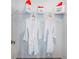 Well-organized walk-in closet with clothing racks, shelves, and humorous decor at 2549 Penguin Blvd, Davenport, FL 33837