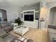 Cozy living room with tile floors features a entertainment center and comfortable seating at 3345 Tesoro Cir, New Smyrna Beach, FL 32168