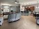 Open floor plan combines living and dining spaces with a view of the kitchen at 3345 Tesoro Cir, New Smyrna Beach, FL 32168