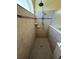 This bathroom features a tiled shower, with a shower head, shower bar, and soap dish at 3345 Tesoro Cir, New Smyrna Beach, FL 32168