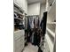 Organized walk-in closet with custom shelves, drawers, and hanging rods providing ample storage for clothing and accessories at 3345 Tesoro Cir, New Smyrna Beach, FL 32168