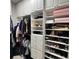 Custom walk-in closet with shelves, drawers, and shoe racks maximizing storage space and keeping belongings neatly organized at 3345 Tesoro Cir, New Smyrna Beach, FL 32168