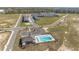 Community featuring a pool, residential buildings, and expansive grounds at 6677 Sw 81St Loop, Ocala, FL 34476