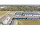 An elevated view reveals modern townhomes with ample parking spaces and surrounding green spaces at 6677 Sw 81St Loop, Ocala, FL 34476