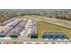 A stunning aerial view shows a community with townhomes and parking at 6677 Sw 81St Loop, Ocala, FL 34476